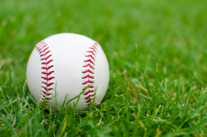 white-baseball-on-grass