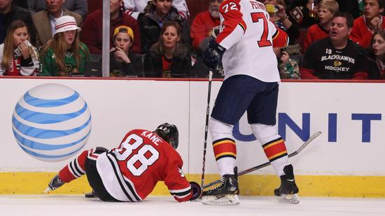 Patrick Kane goes down. (AP)