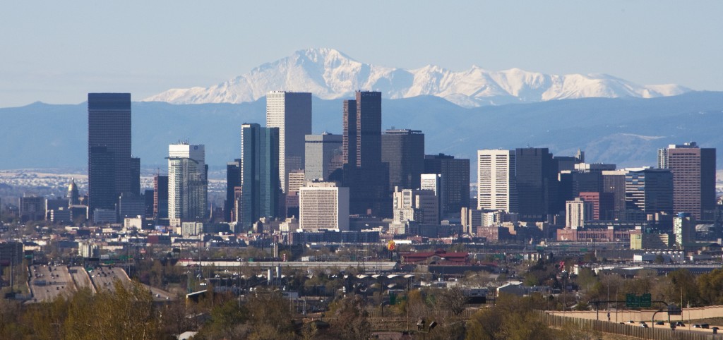 The Colorado State capitol dome in real Colorado gold gilding stands on the left in this skyline shot of downtown with the distant Pike's Peak mountain looming in the background in Denver on April 30, 2011. 